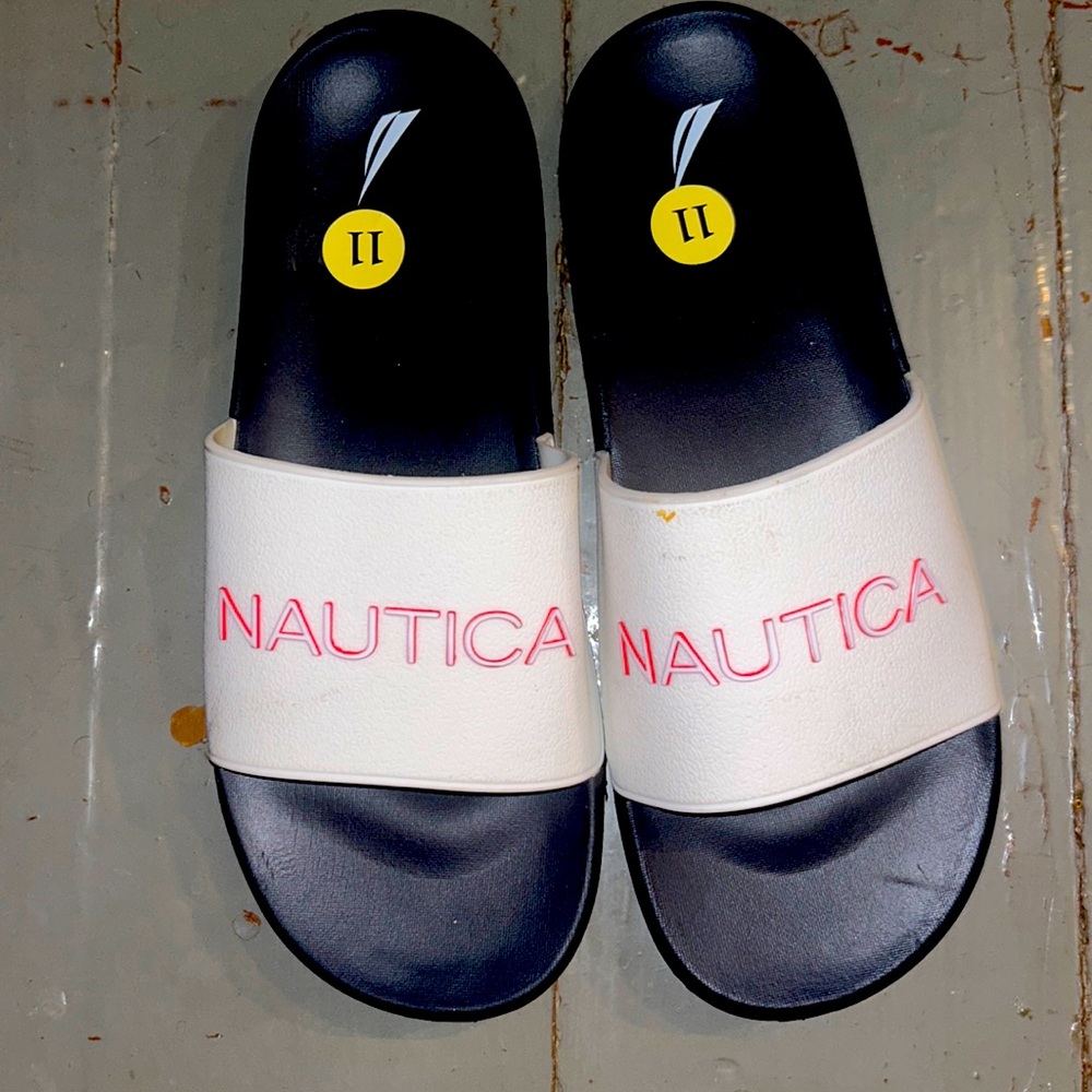 Men’s footwear sandals flip flops Blue, white, and red size 11 men never worn